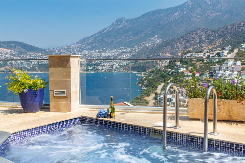 a swimming pool with a view of the mountains at Villa Yar in Kalkan