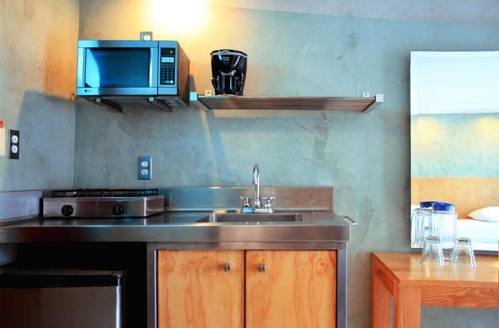 Kuchyň nebo kuchyňský kout v ubytování Hotel Rio Malecon