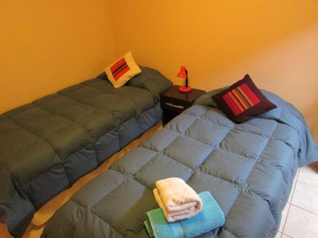 Postel nebo postele na pokoji v ubytování Hostal Desert