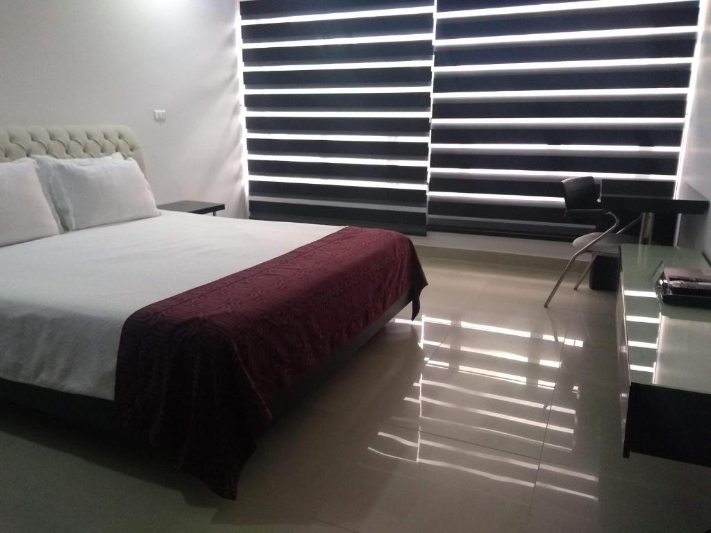 Postel nebo postele na pokoji v ubytování Hotel Merlott 70