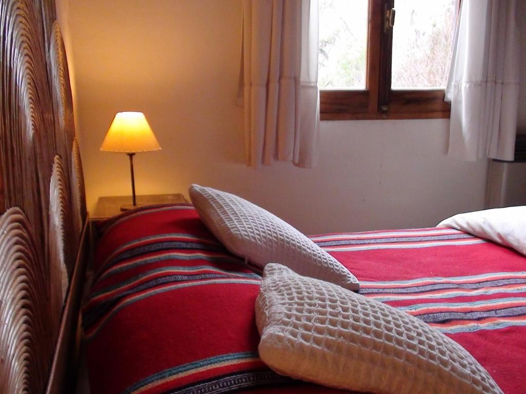 Postel nebo postele na pokoji v ubytování Manantial Hostería & Cabañas