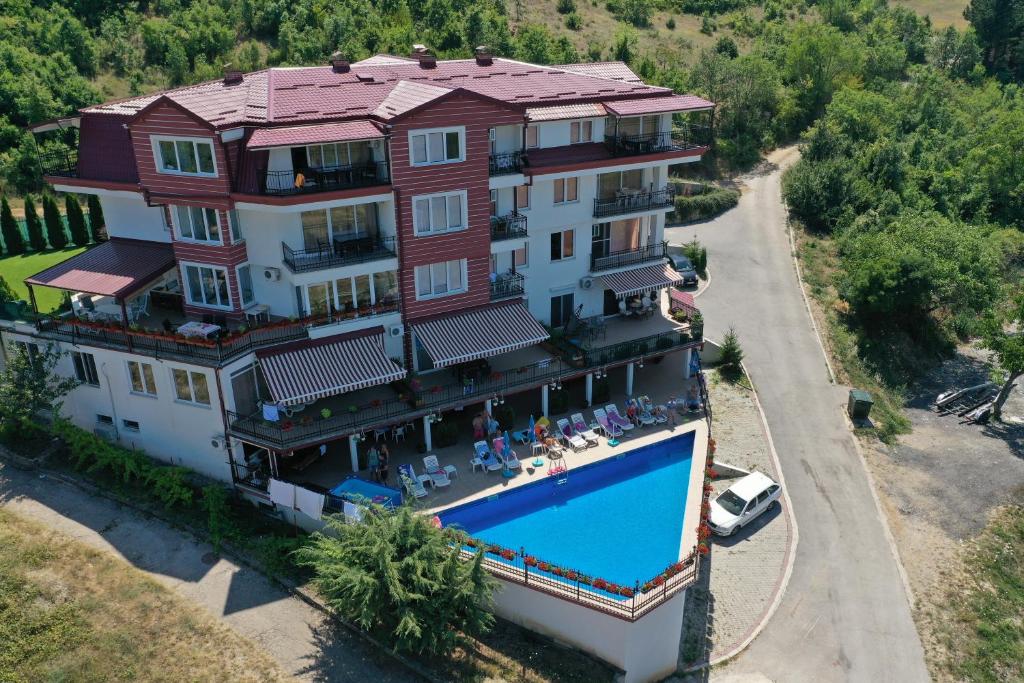 an aerial view of a large house with a swimming pool at Villa Marta in Ohrid