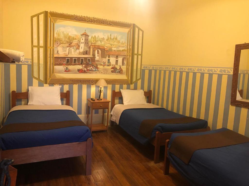Postel nebo postele na pokoji v ubytování Hospedaje Turistico Recoleta