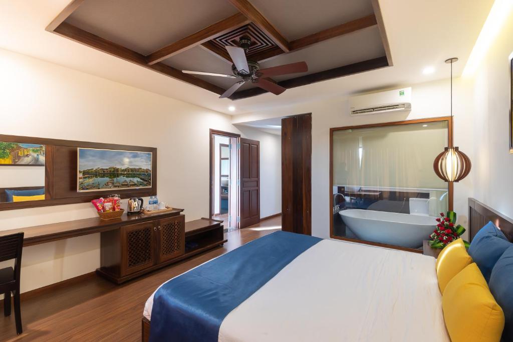 Giường trong phòng chung tại Eden Hoi An Villas