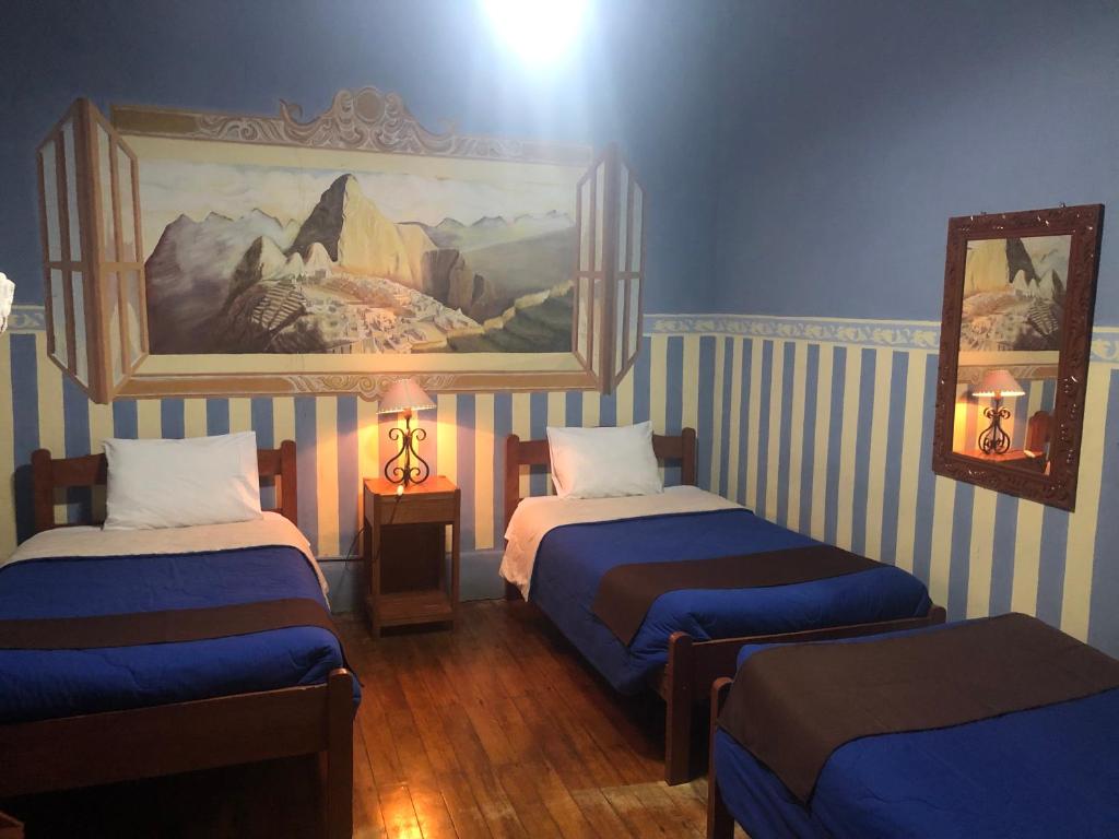 Postel nebo postele na pokoji v ubytování Hospedaje Turistico Recoleta