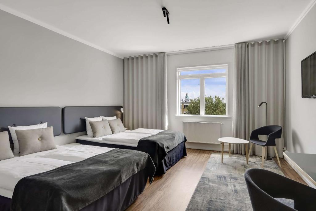 Postel nebo postele na pokoji v ubytování Hotel Svendborg