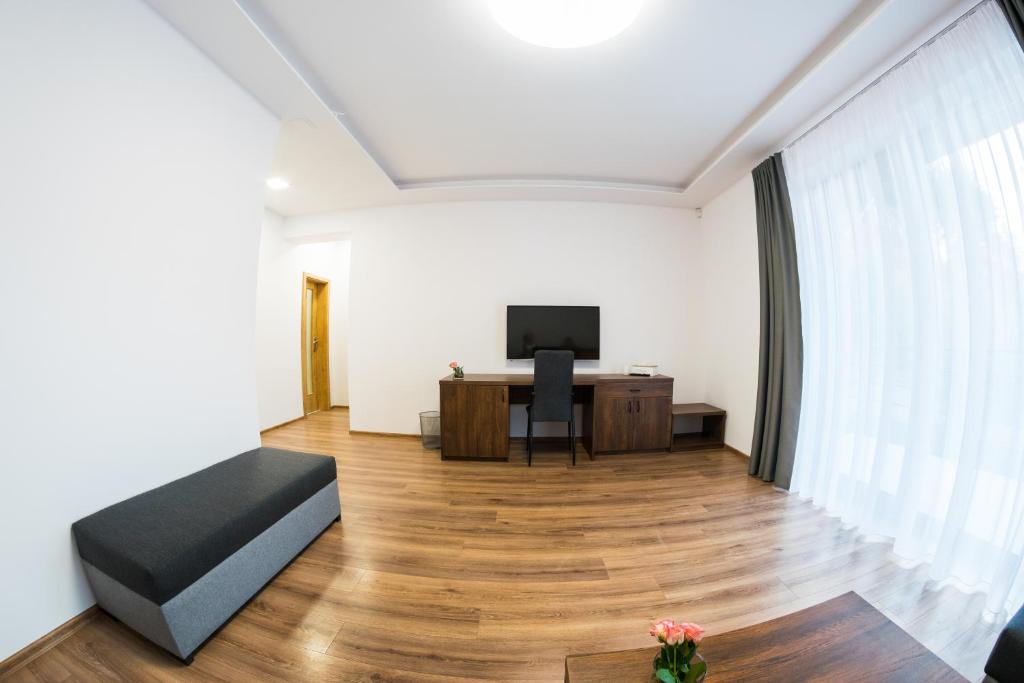 TV a/nebo společenská místnost v ubytování Chata Monumento