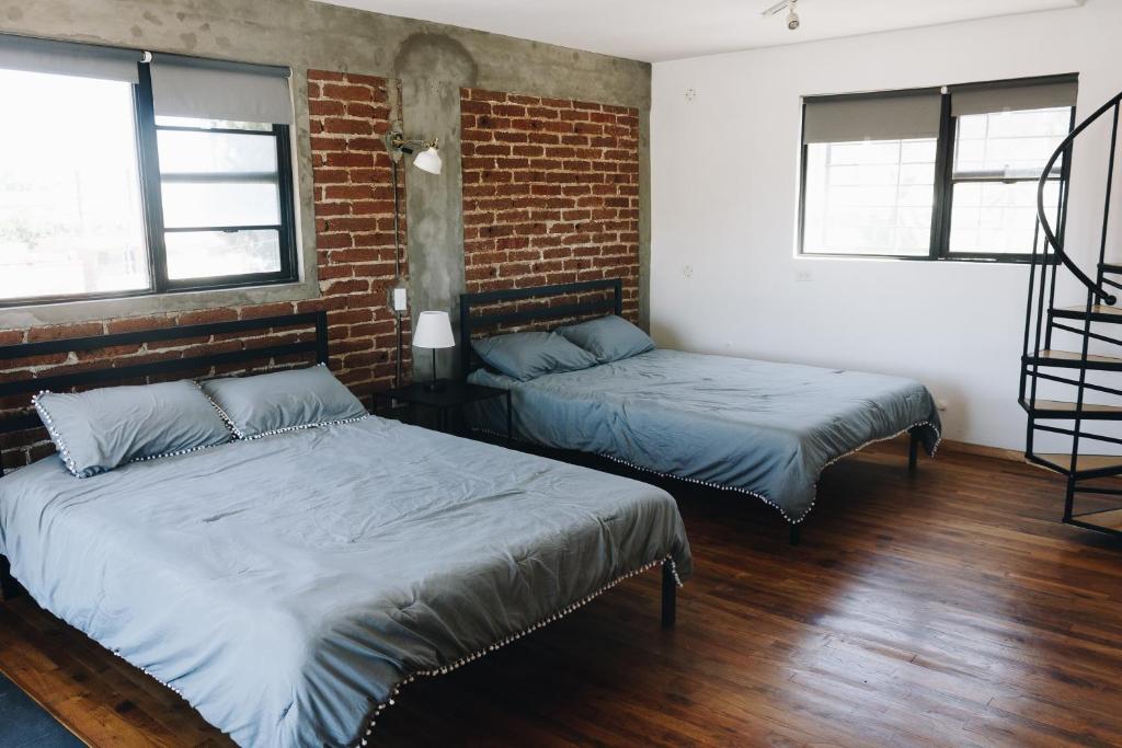 Postel nebo postele na pokoji v ubytování Coyote Lofts-Estacion Federal