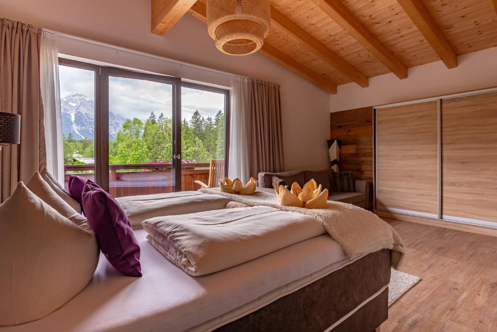 Postel nebo postele na pokoji v ubytování Hotel Alpennest