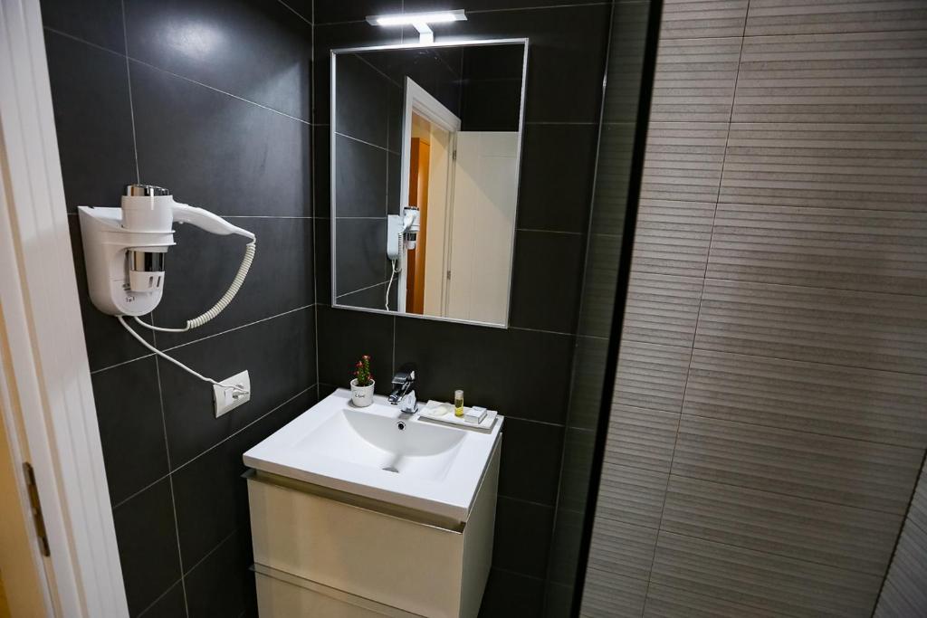 Koupelna v ubytování Home Hotel