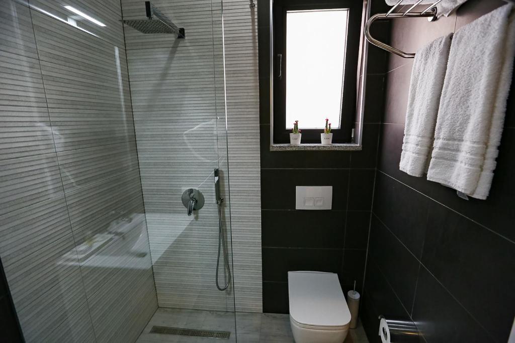 Koupelna v ubytování Home Hotel