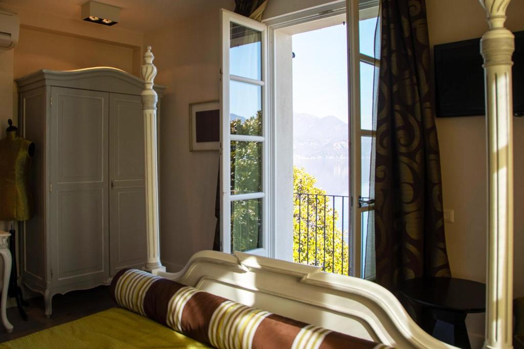 Postel nebo postele na pokoji v ubytování Hotel Arancioamaro