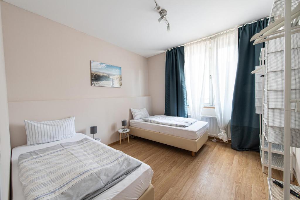 Postel nebo postele na pokoji v ubytování SOVA Pension Baunatal