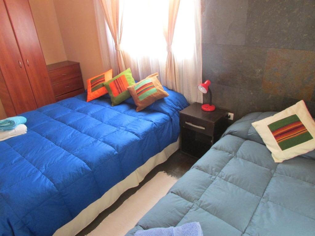 Postel nebo postele na pokoji v ubytování Hostal Desert