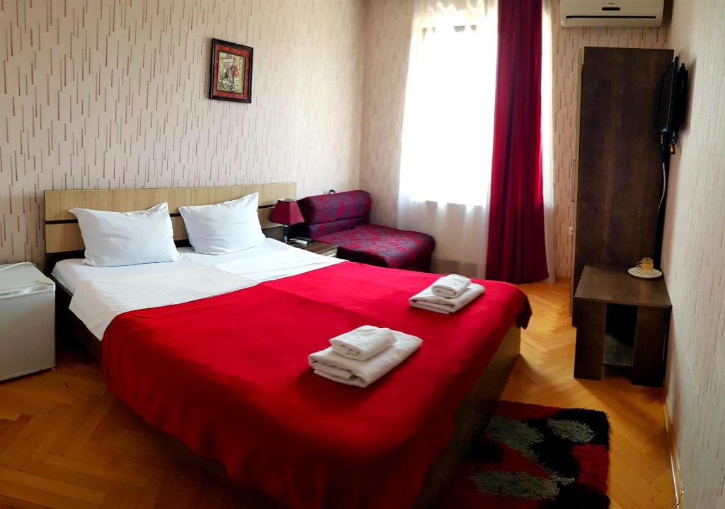Postel nebo postele na pokoji v ubytování Bonus Hotel
