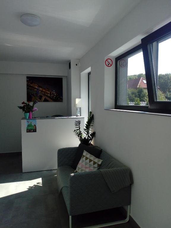 Televízia a/alebo spoločenská miestnosť v ubytovaní Villa Centrum