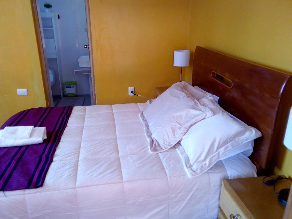 Łóżko lub łóżka w pokoju w obiekcie Musqoy Wasi de Gonzalo