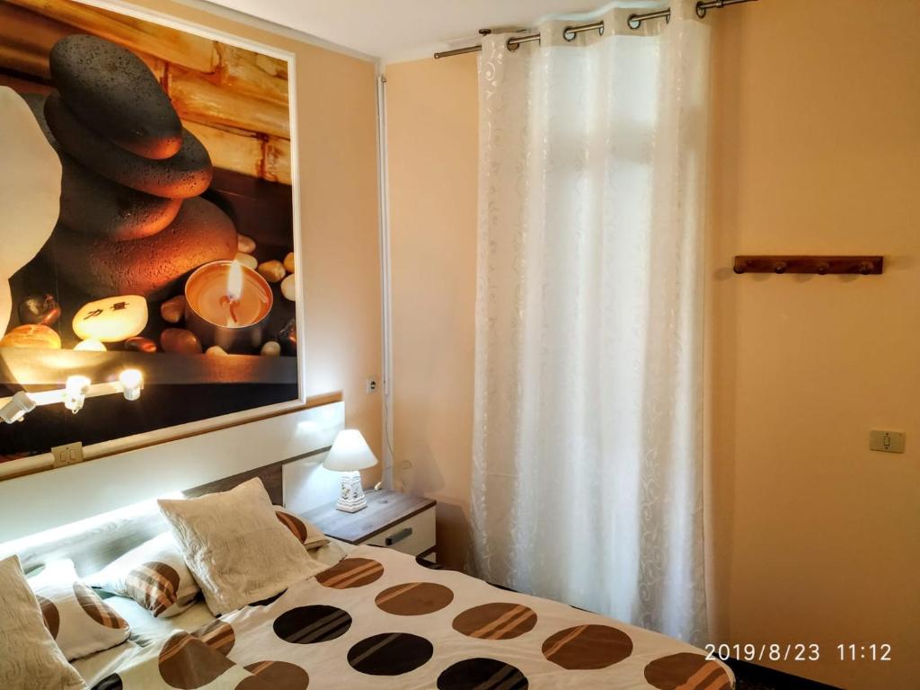 a small child laying on a bed in a bedroom at South Tenerife 471 in Costa Del Silencio