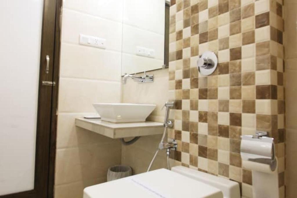 Koupelna v ubytování Hotel Aaram Orchard
