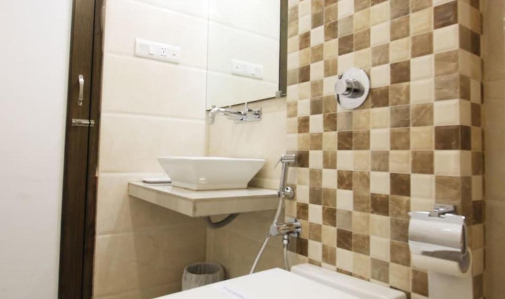 Koupelna v ubytování Hotel Aaram Orchard