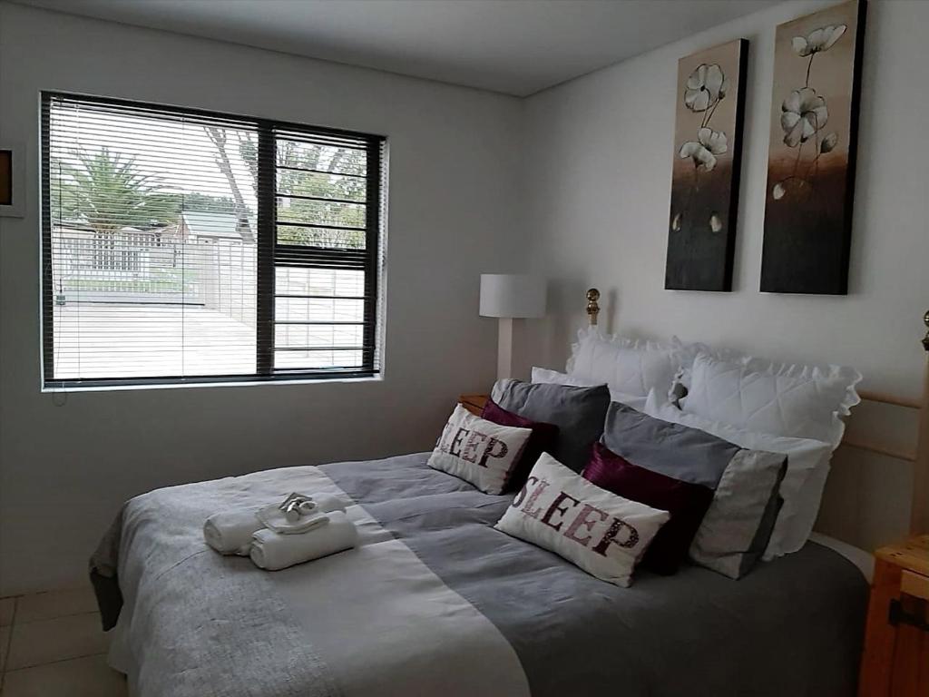 Ένα ή περισσότερα κρεβάτια σε δωμάτιο στο Bergsight Self Catering Accommodation