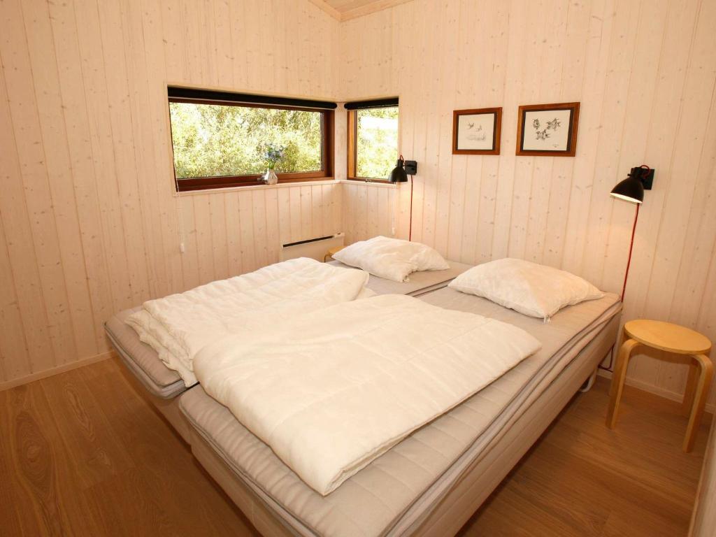 Postel nebo postele na pokoji v ubytování 7 person holiday home in Vestervig-By Traum