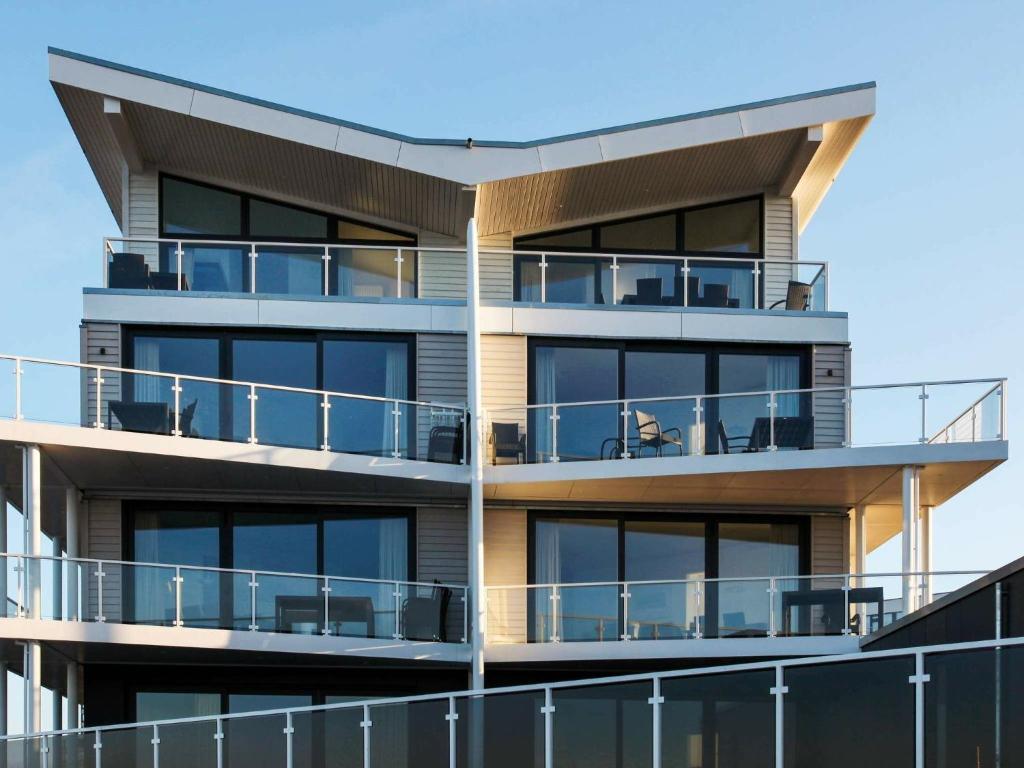 a building with balconies on the side of it at 8 person holiday home in Wendtorf in Wendtorf