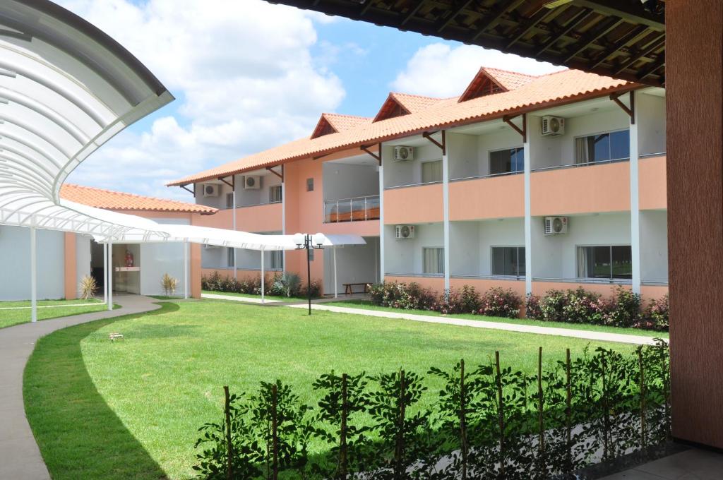 a view of the courtyard of an apartment building at Santa Rosa Hotel in Juazeiro do Norte