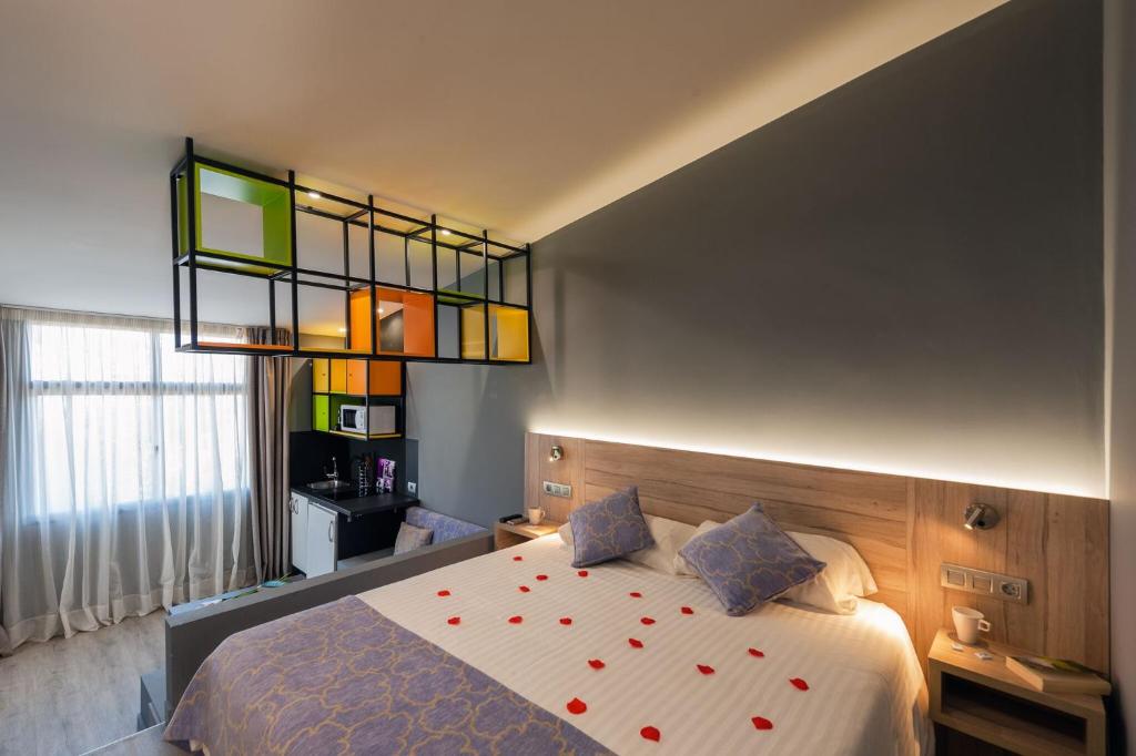 Postel nebo postele na pokoji v ubytování Apartamentos NataLis