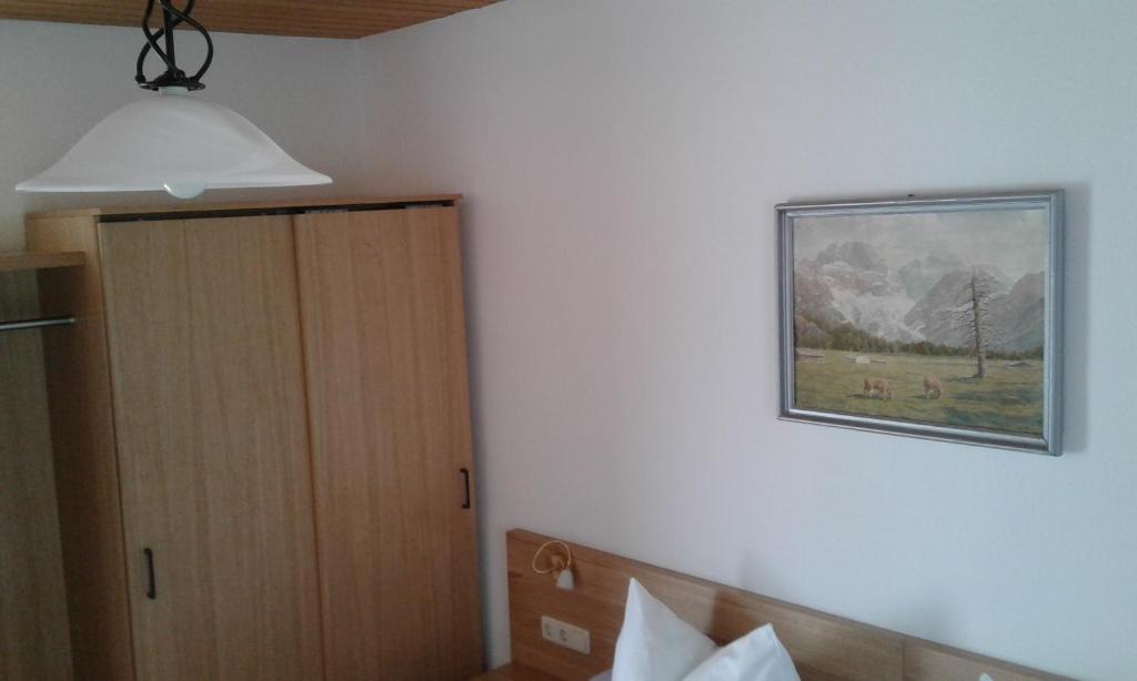 Postel nebo postele na pokoji v ubytování Hotel Garni Post
