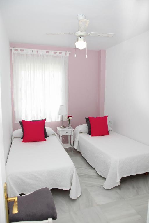 Posteľ alebo postele v izbe v ubytovaní Apartamento Centro Sanlucar