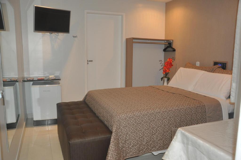 Postel nebo postele na pokoji v ubytování Hotel Sempre Bahia