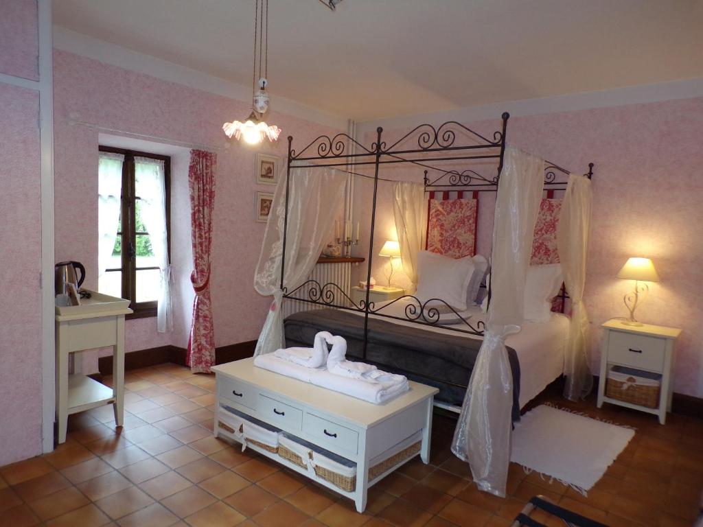 Postel nebo postele na pokoji v ubytování Moulin de Bénédicty