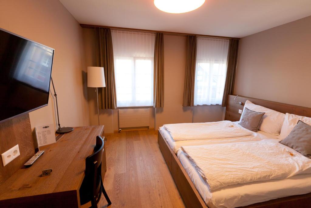 Postel nebo postele na pokoji v ubytování Hotel Bären