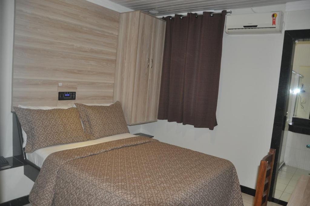 Postel nebo postele na pokoji v ubytování Hotel Sempre Bahia