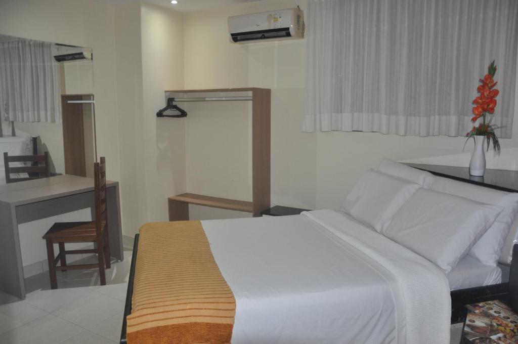 Postel nebo postele na pokoji v ubytování Hotel Sempre Bahia