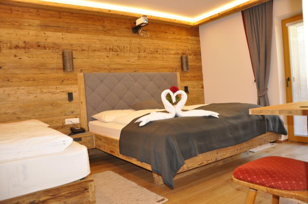 Voodi või voodid majutusasutuse Hotel Rosengarten toas