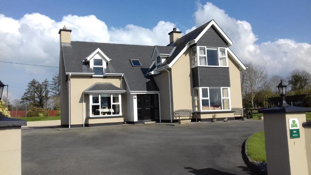 a large house with a driveway in front of it at Ashfield B&B in Kenmare