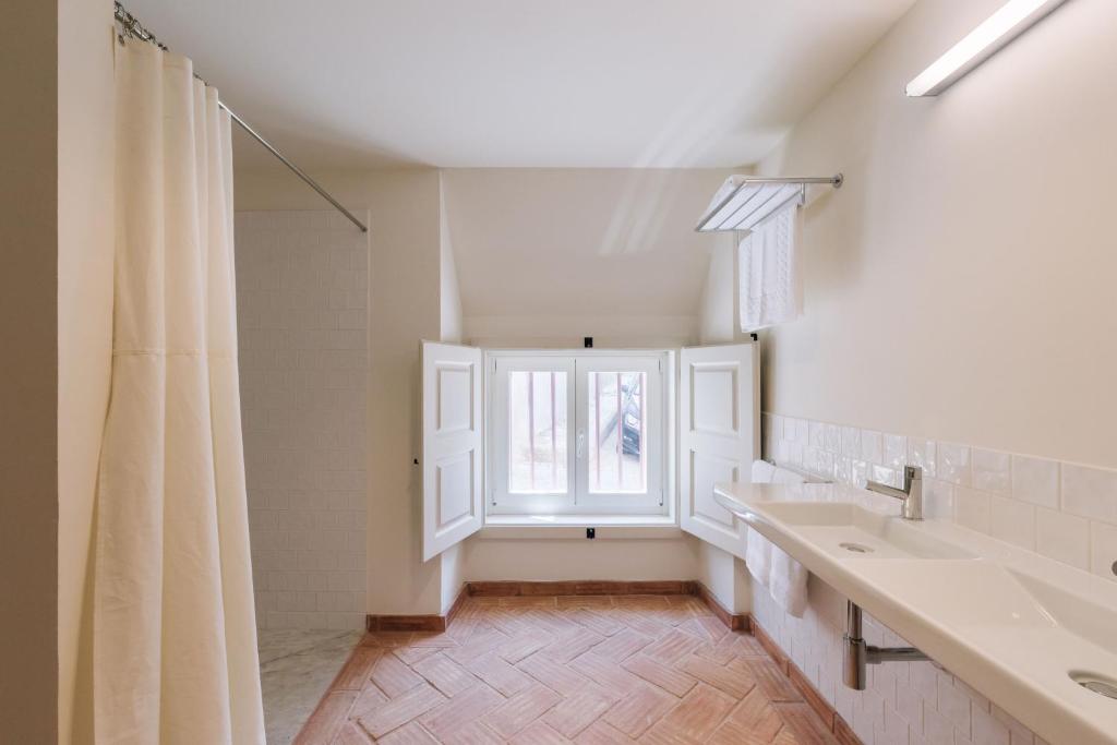 Postel nebo postele na pokoji v ubytování Travassos 11