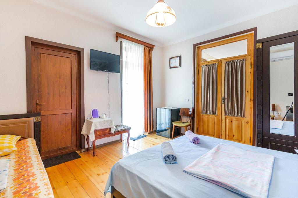 Postel nebo postele na pokoji v ubytování Guesthouse Vashlovani
