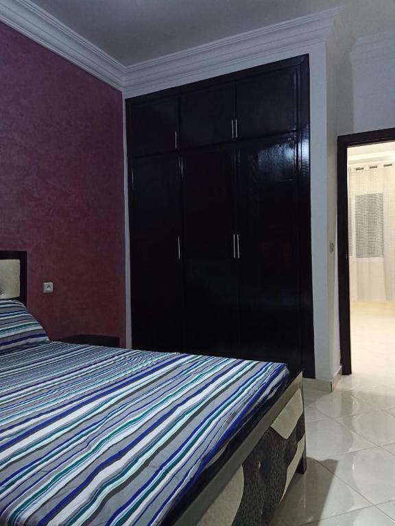 Postel nebo postele na pokoji v ubytování apartement 5 residence oulad touimi