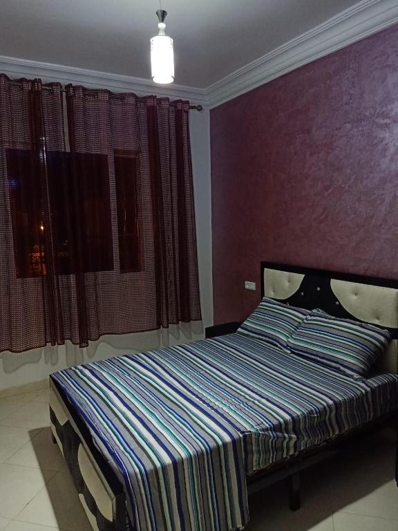 Postel nebo postele na pokoji v ubytování apartement 5 residence oulad touimi