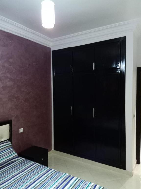 Postel nebo postele na pokoji v ubytování apartement 5 residence oulad touimi
