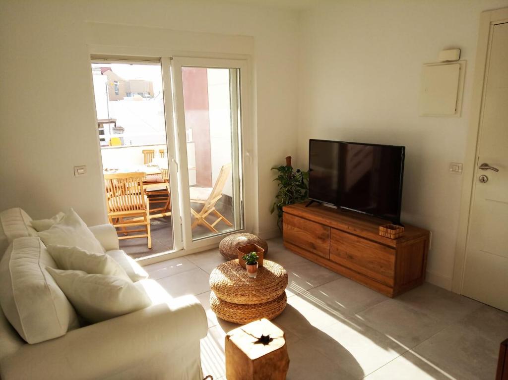 A television and/or entertainment centre at ATICO VIEW NATURE CORRALEJO