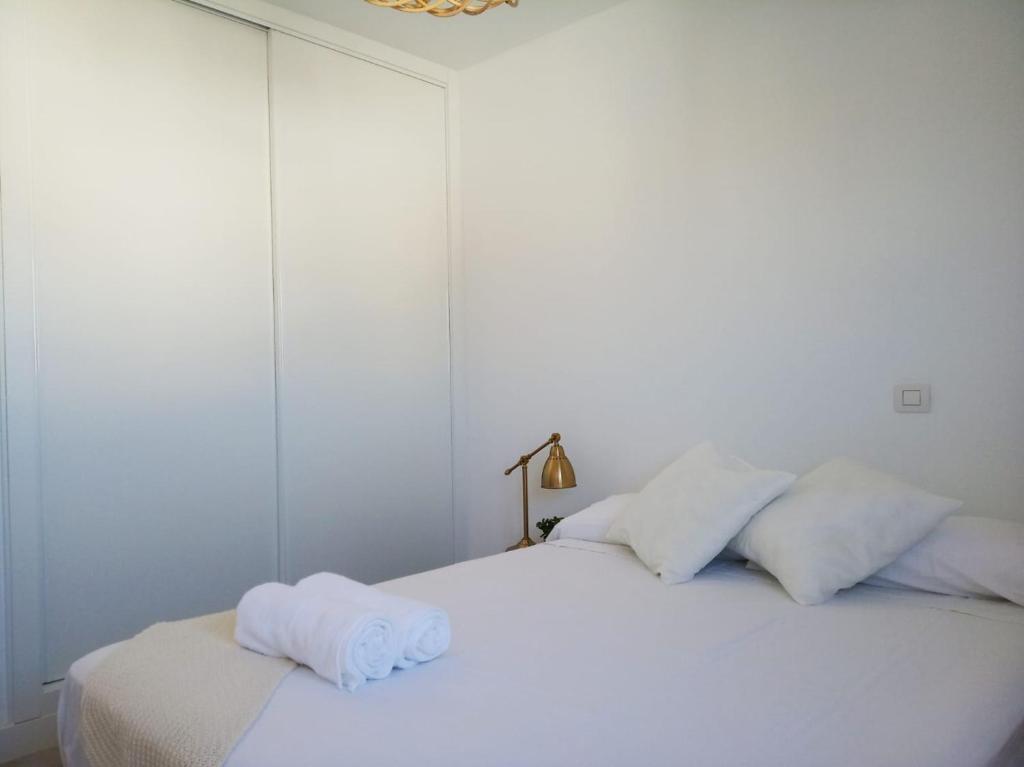 A bed or beds in a room at ATICO VIEW NATURE CORRALEJO