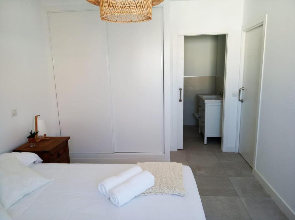 A bed or beds in a room at ATICO VIEW NATURE CORRALEJO
