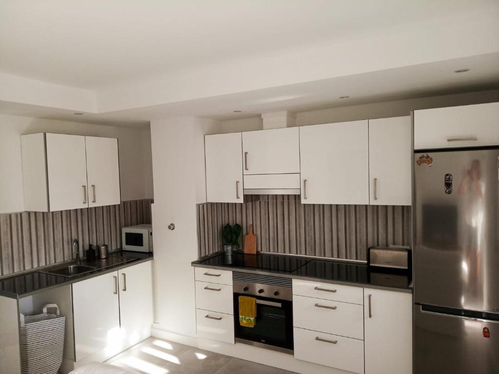 A kitchen or kitchenette at ATICO VIEW NATURE CORRALEJO