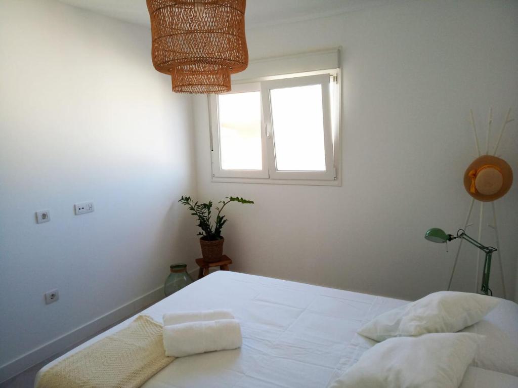 A bed or beds in a room at ATICO VIEW NATURE CORRALEJO