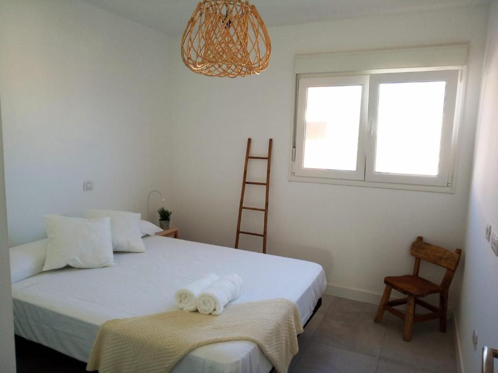 A bed or beds in a room at ATICO VIEW NATURE CORRALEJO