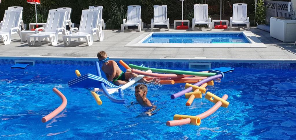 Bazén v ubytovaní Ambre Mare - Wypoczynek pod Palmami alebo v jeho blízkosti
